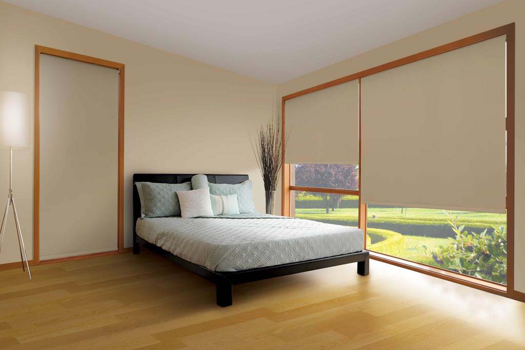 Blockout roller blinds in a bedroom
