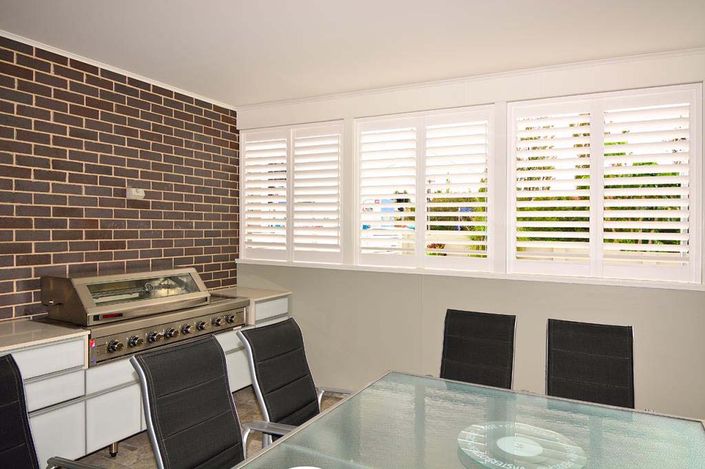 Polysatin shutters outdoor barbeque area