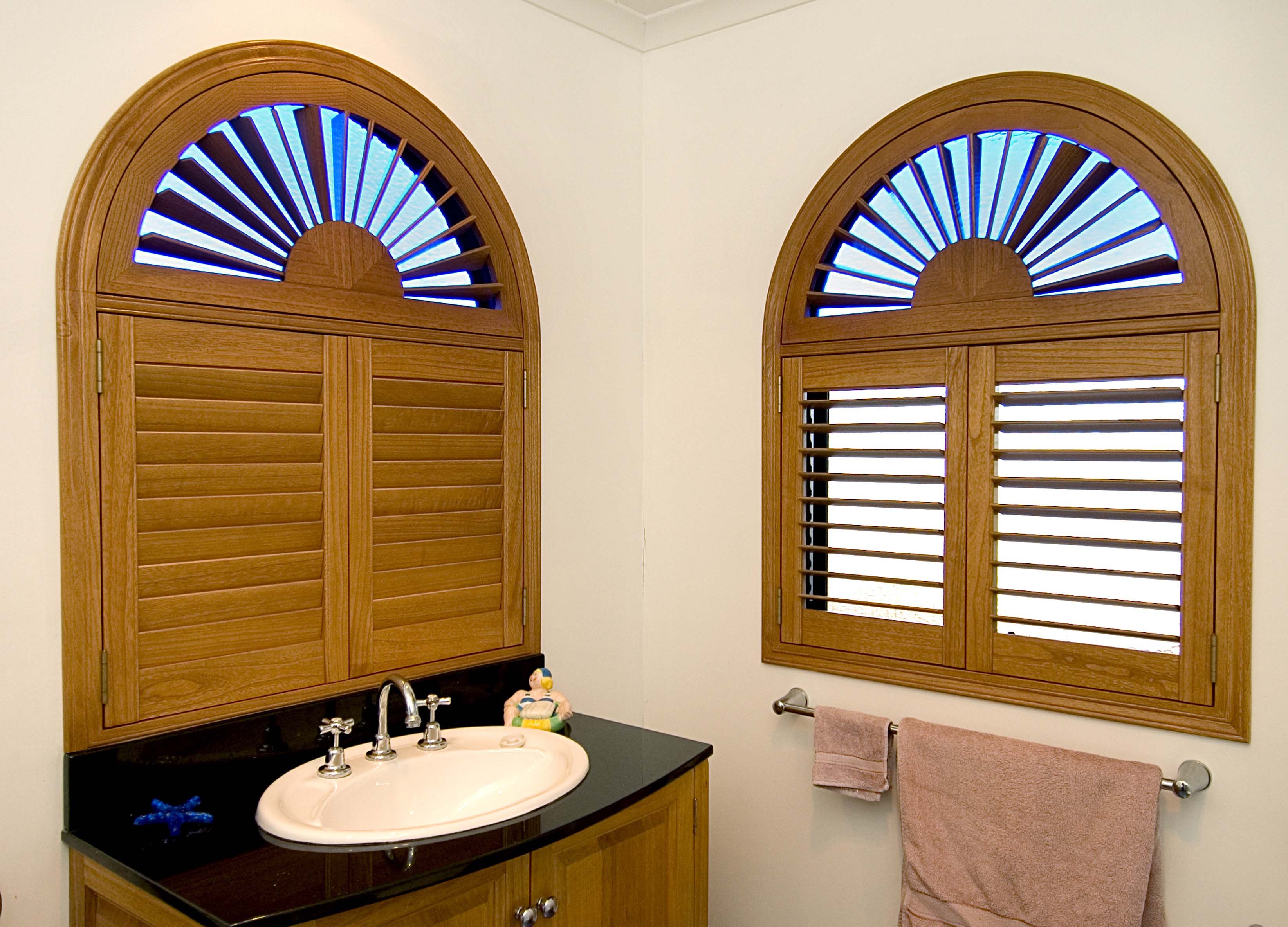 Shaped timber shutters in bathroom