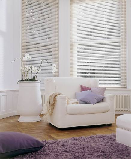 Venetian Country Woods blinds in lounge area with purple accessories